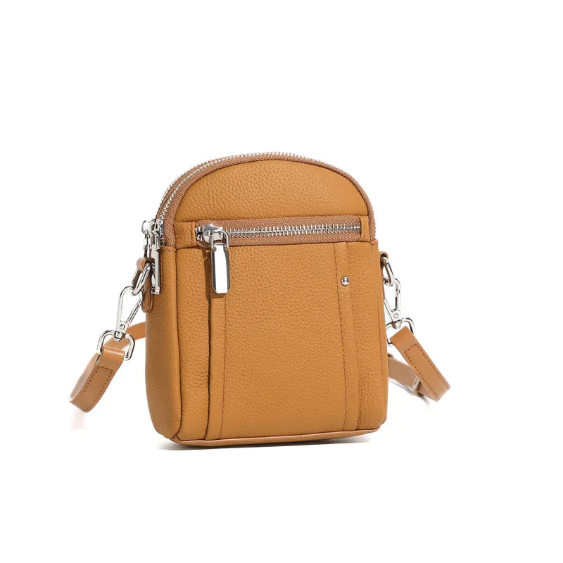 Women's mini genuine leather crossbody bag in brown — compact saddle shoulder bag