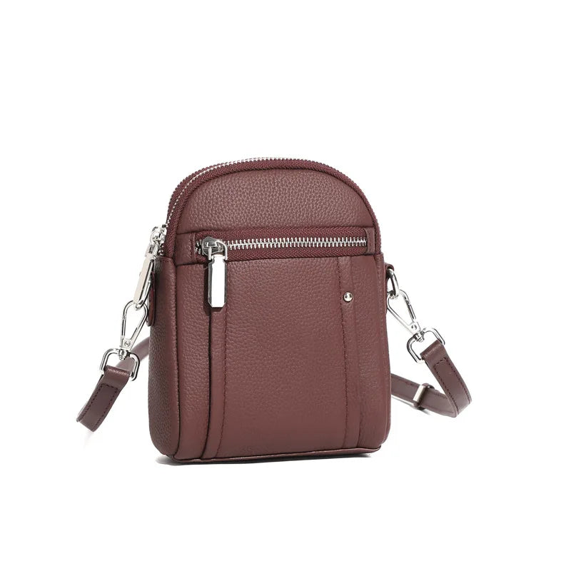 Women's mini genuine leather crossbody bag in wine red — compact saddle shoulder bag