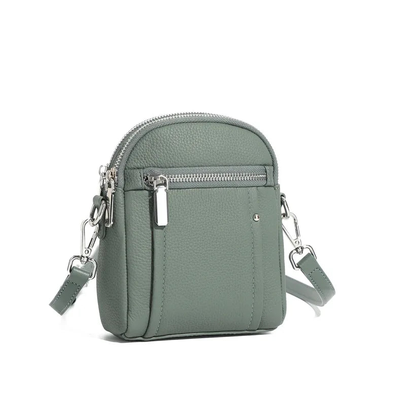 Women's mini genuine leather crossbody bag in blue — compact saddle shoulder bag