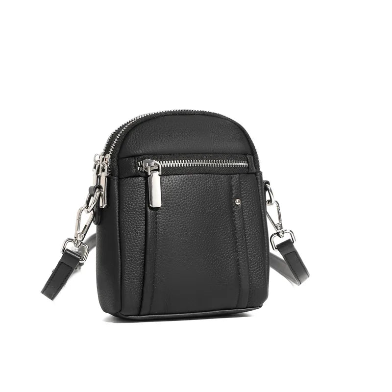 Women's mini genuine leather crossbody bag in black — compact saddle shoulder bag