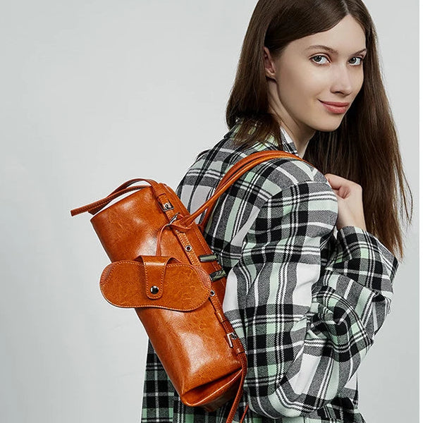 Woman wearing retro baguette bag tucked under arm — lifestyle shot